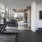 State-of-the-art fitness center with cardio machines, weights, and city views at 2811 Maple