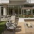 Outdoor resident lounge with fire pit, seating, and grilling area at 2811 Maple