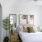 Bright bedroom with modern furnishings, abstract artwork, and large windows at 2811 Maple