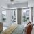 Model bedroom with upholstered headboard, stylish decor, and views of Uptown Dallas
