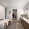 Spa-inspired model bathroom with soaking tub, double vanity, and walk-in closet at 2811 Maple