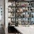 Designer bookshelf filled with curated books and sculptures in a modern resident lounge at 2811 Maple