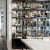 Designer bookshelf filled with curated books and sculptures in a modern resident lounge at 2811 Maple