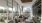 Modern resident lounge with floor-to-ceiling windows, comfortable seating, and city views at 2811 Maple