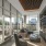 Modern resident lounge with floor-to-ceiling windows, comfortable seating, and city views at 2811 Maple